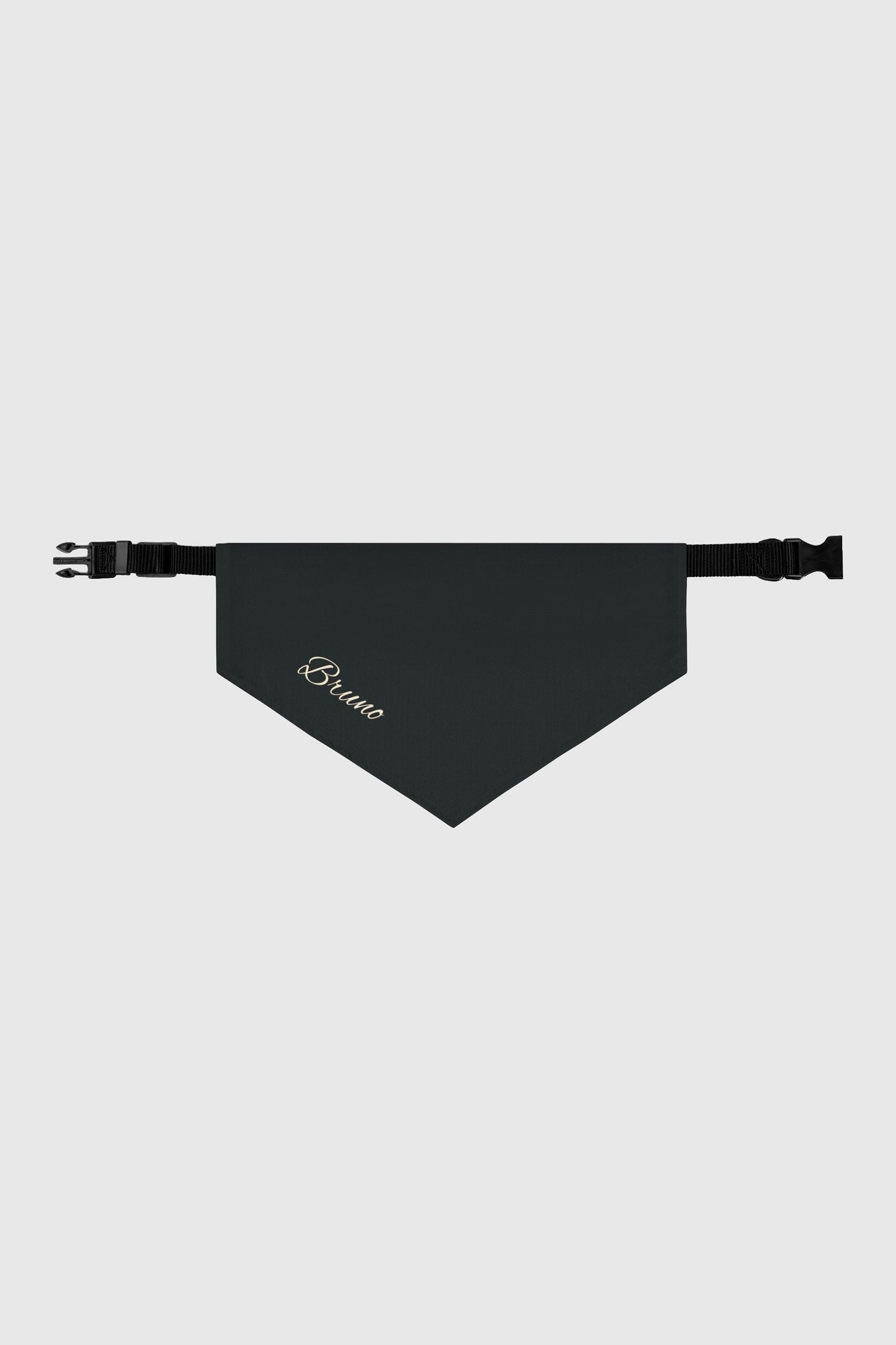 Golden retriever wearing black personalized dog bandana with custom name