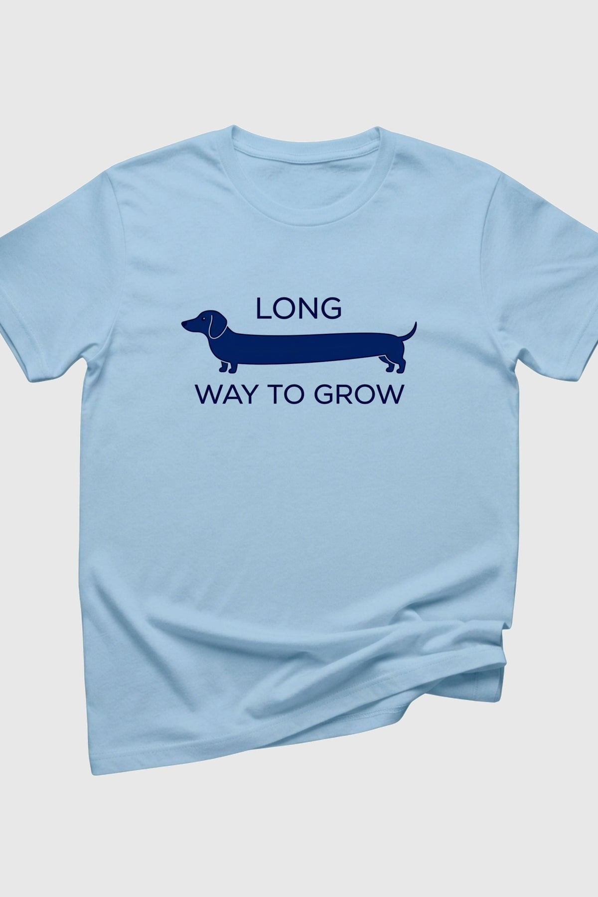 Man wearing black t-shirt with Long Way to Grow dachshund print