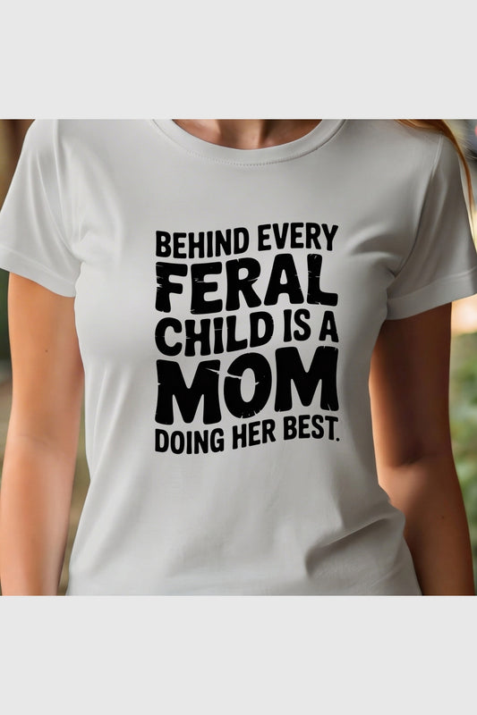 Woman wearing white Behind Every Feral Child Is a Mom t-shirt