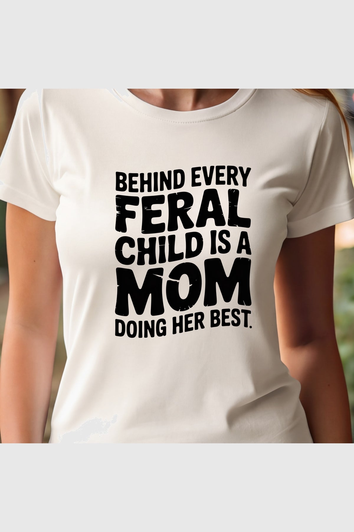 Feral Child Is a Mom Doing Her Best print close-up on white t-shirt