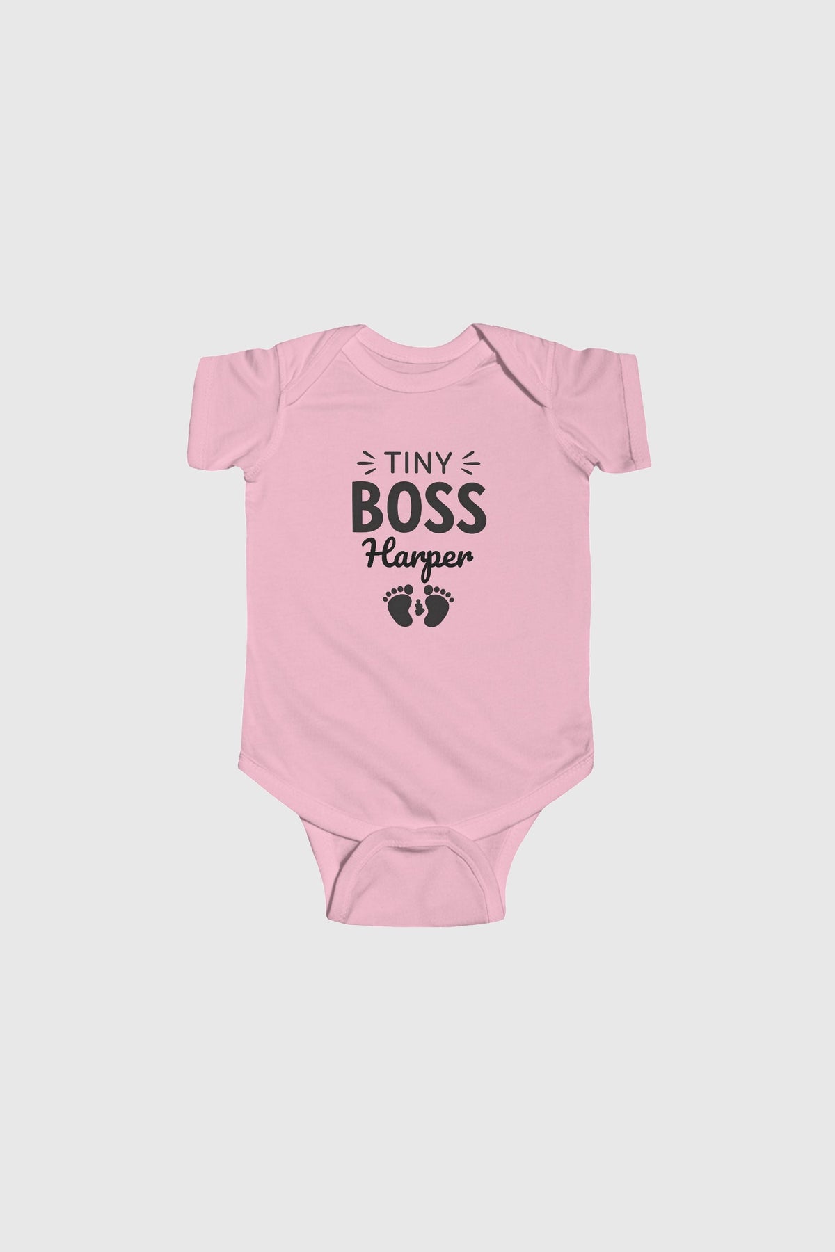 Pink personalized baby bodysuit with Tiny Boss custom name, snap closure