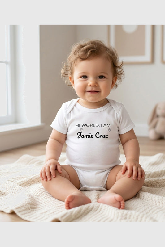 Baby wearing white Hi World personalized bodysuit, snap closure