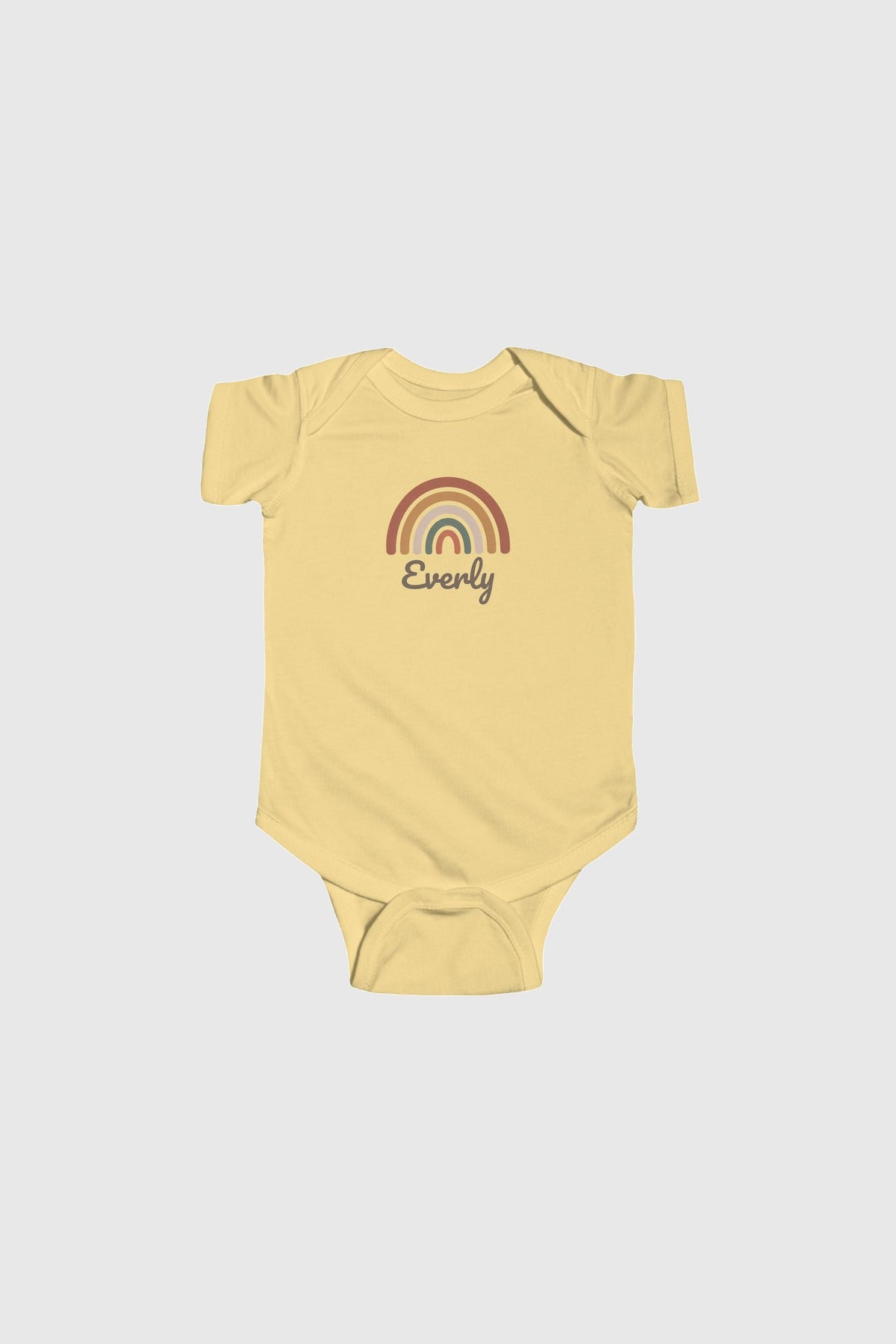 Baby wearing pink personalized rainbow bodysuit