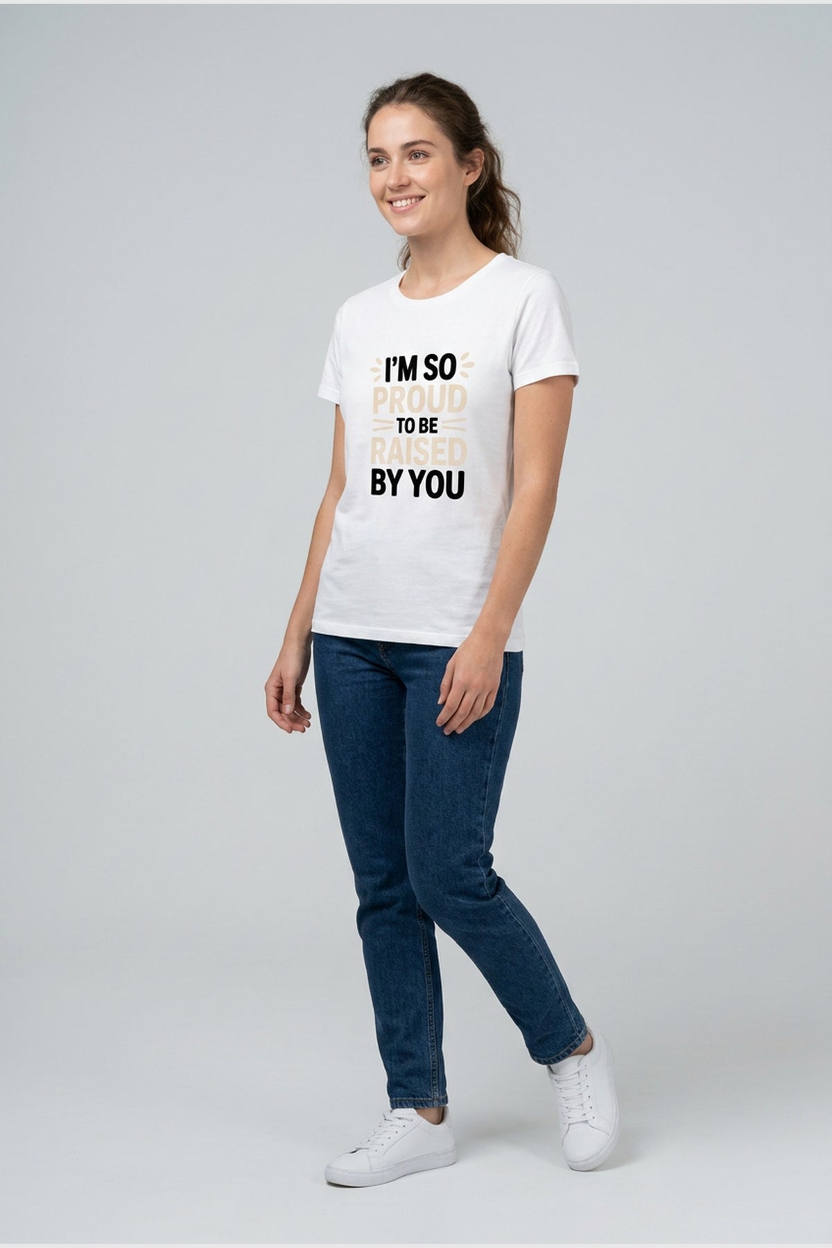 Woman wearing white t-shirt with im so proud funny mom print
