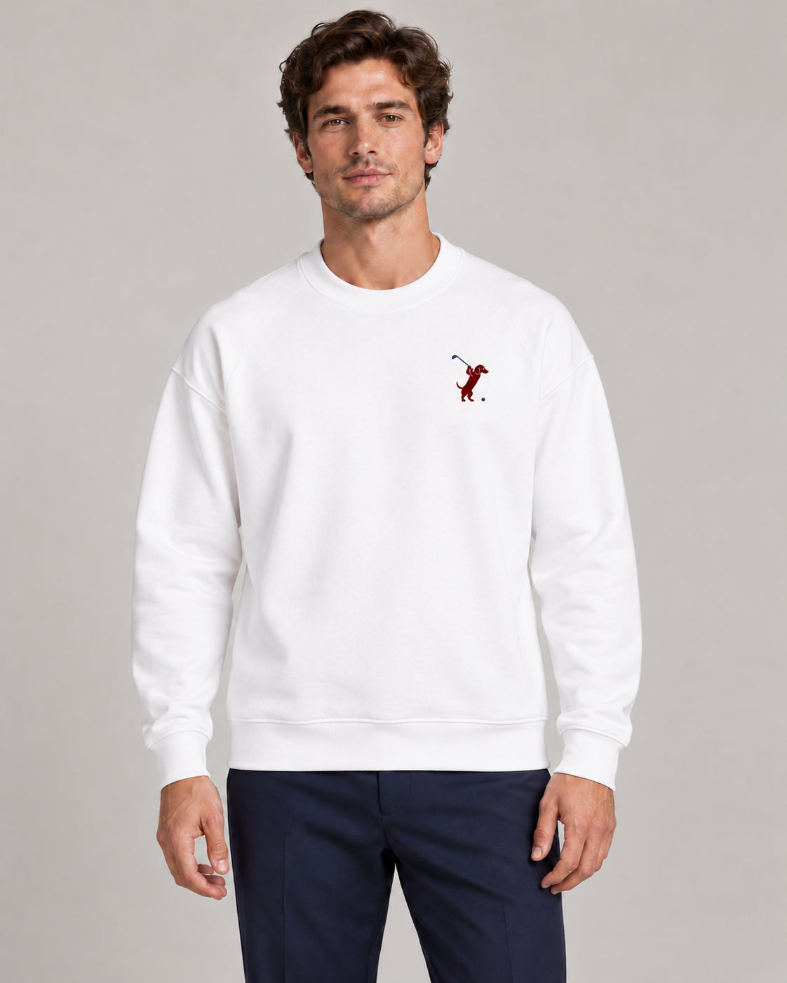 Man wearing Swing dachshund golf sweatshirt, front studio view. Color: White
