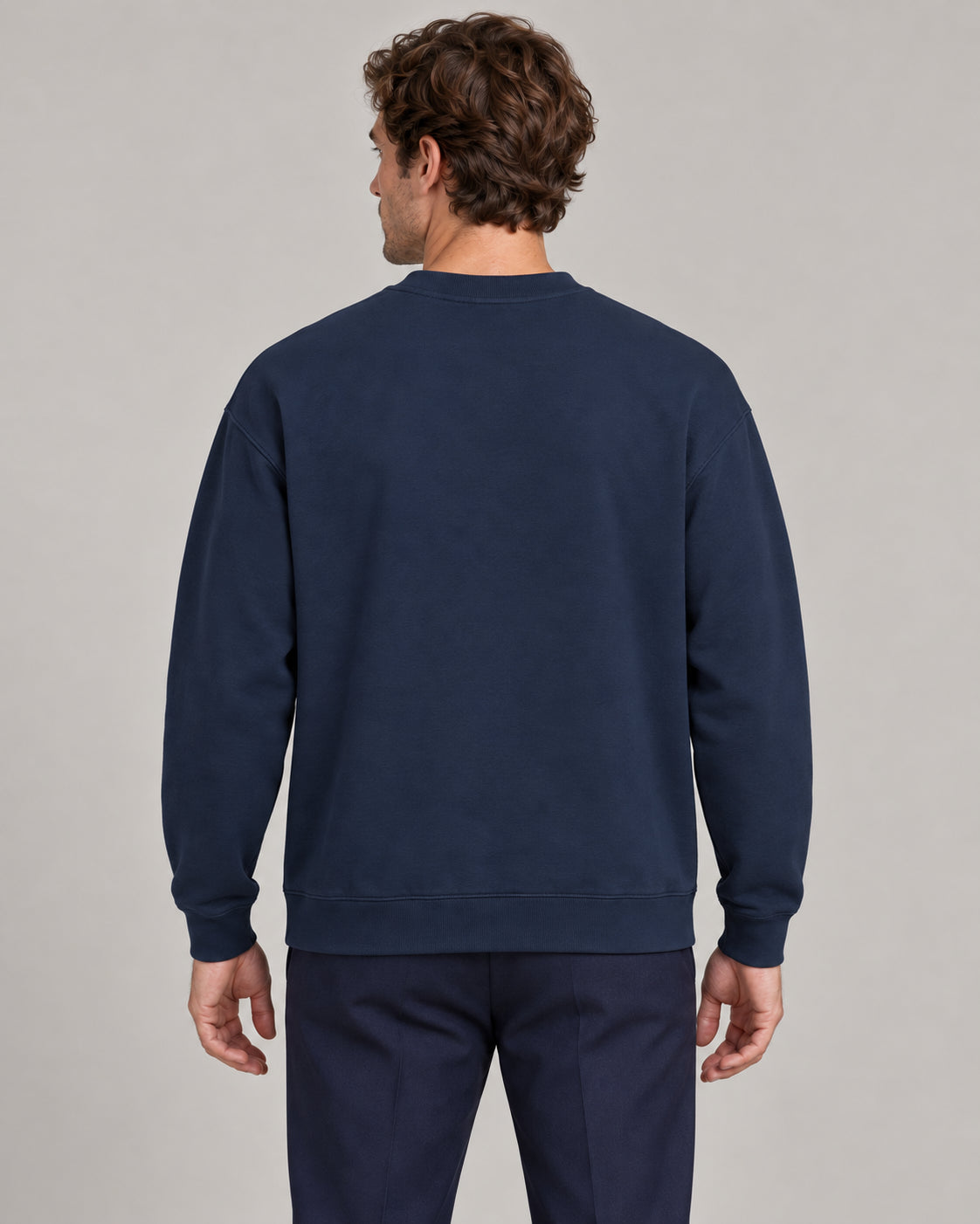 Man wearing Swing dachshund golf sweatshirt, back studio view. Color: Navy