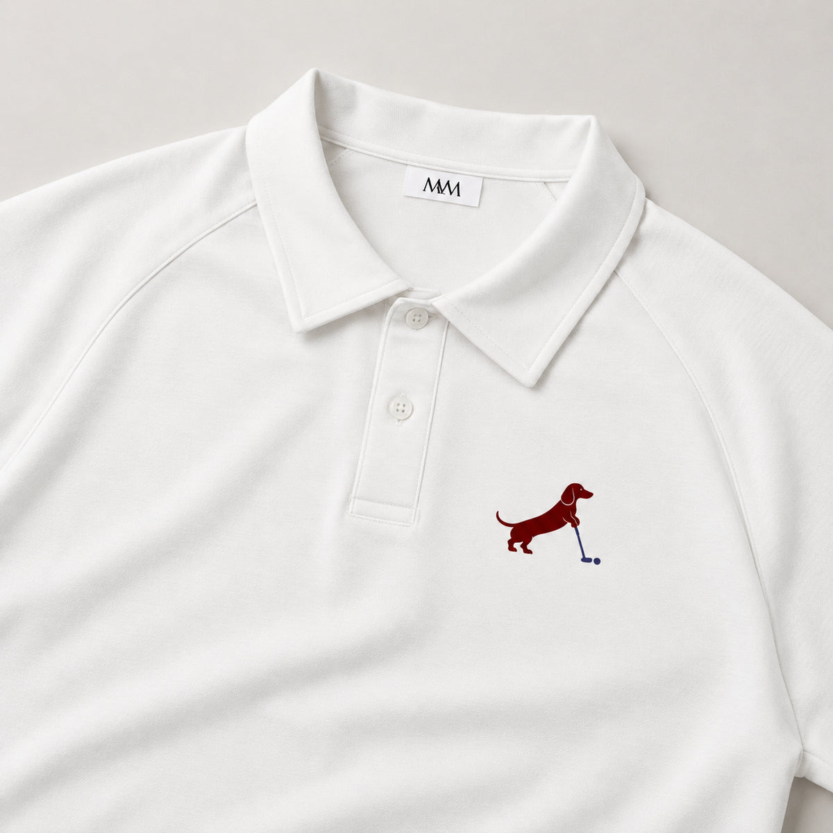 Putting dachshund golf polo, chest logo detail. Color: White