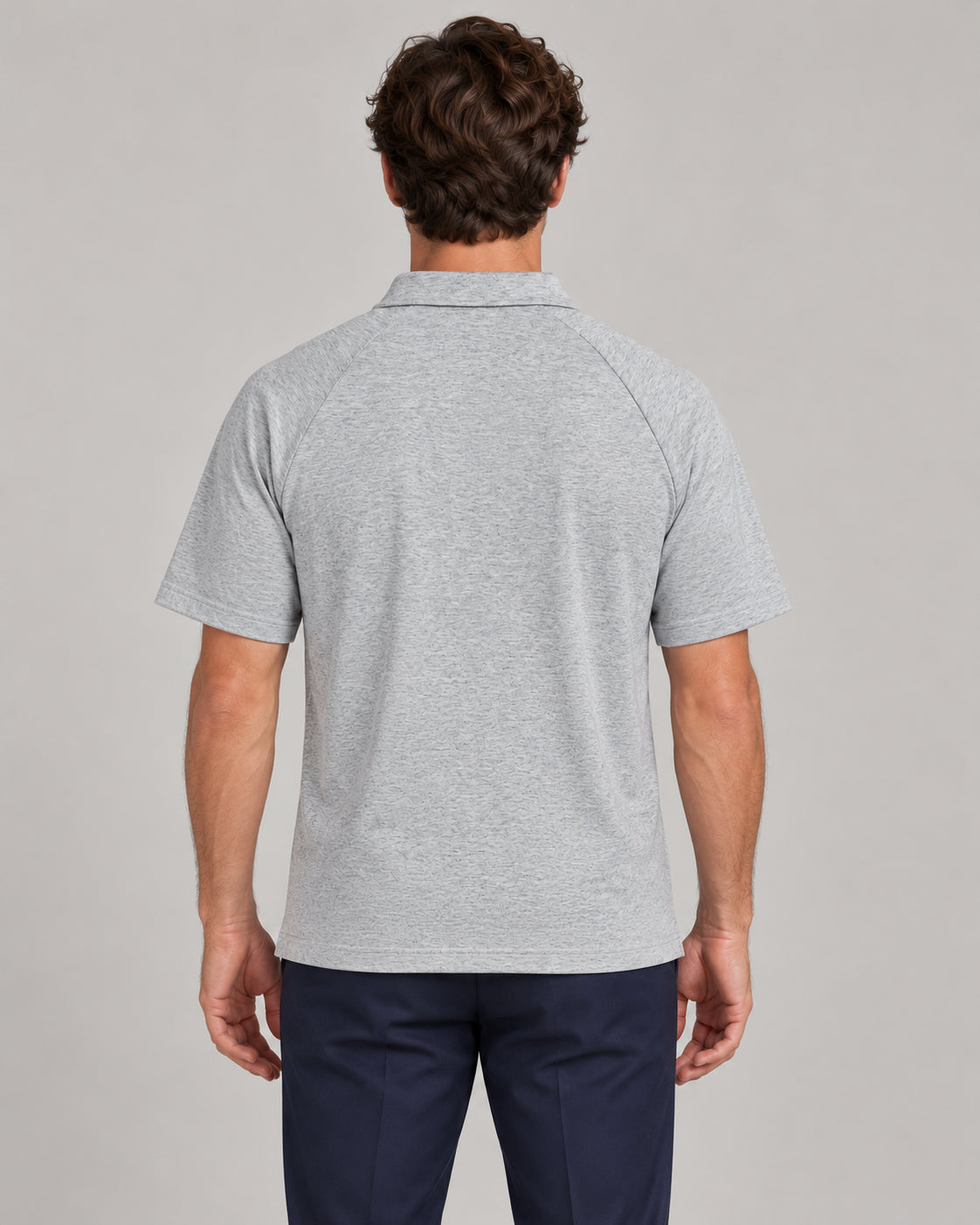Man wearing Putting dachshund golf polo, back studio view. Color: Flower Gray