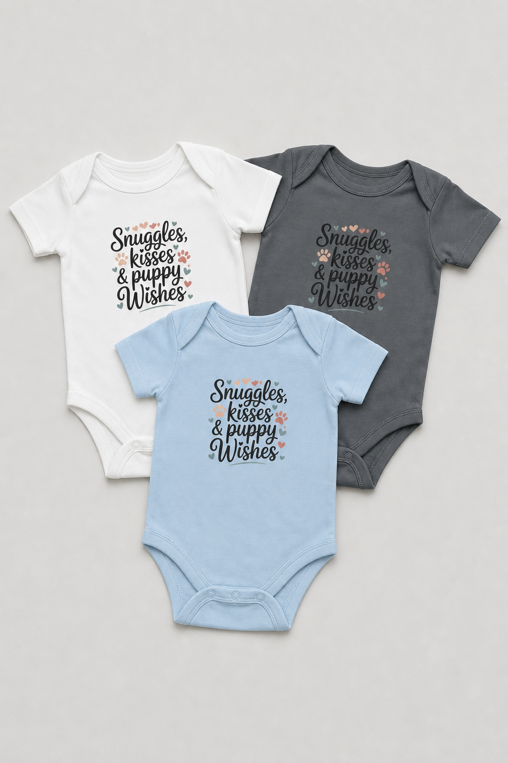 Baby wearing pink Snuggles Kisses Puppy Wishes bodysuit
