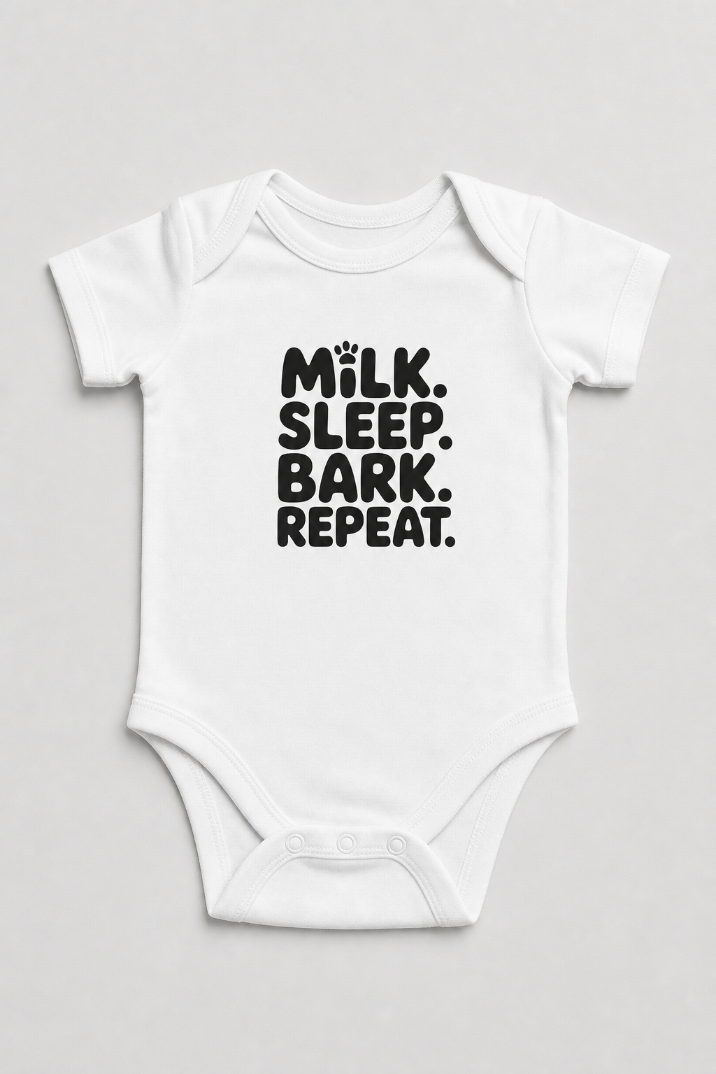 Pink baby bodysuit with Milk Sleep Bark Repeat dog print, snap closure