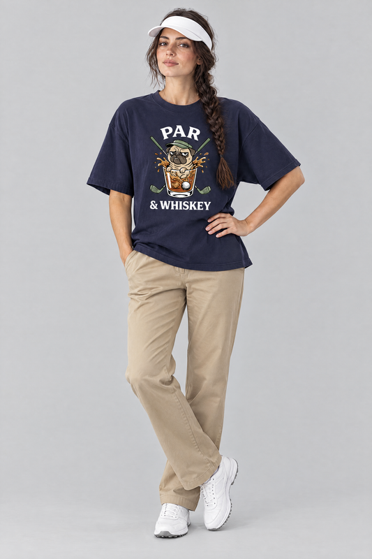 Woman wearing the Par & Whiskey Pug Golf Tee in navy with khaki trousers and a white golf visor. Color: Navy