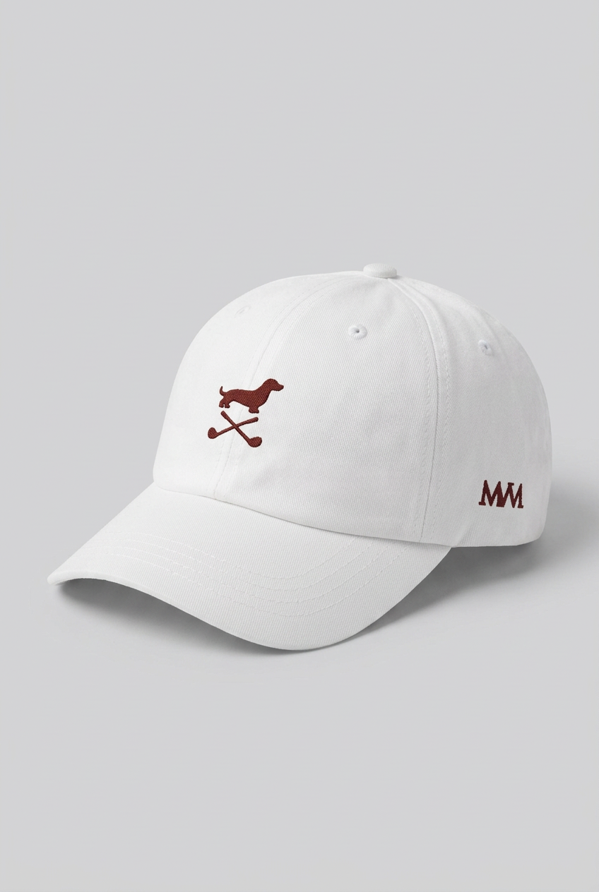 Color: White. Golf cap, angled side view with burgundy Club Mark dachshund and MVM monogram