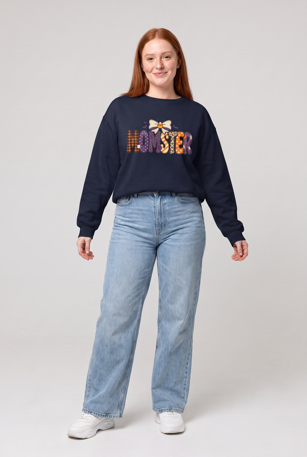 Woman wearing the Momster Halloween sweatshirt in navy, front view. Color: Navy