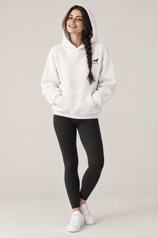 Smiling woman with hood up and hands in the pocket of a white Club & Swing dachshund golf hoodie and black leggings. Color: White