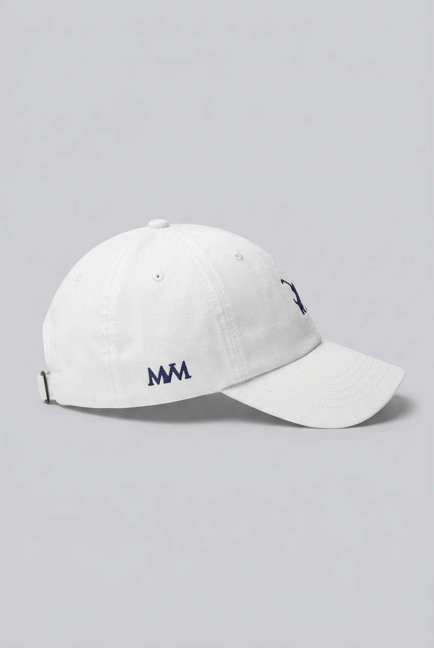 Color: White. Golf cap, angled side view with navy Swing dachshund and MVM monogram