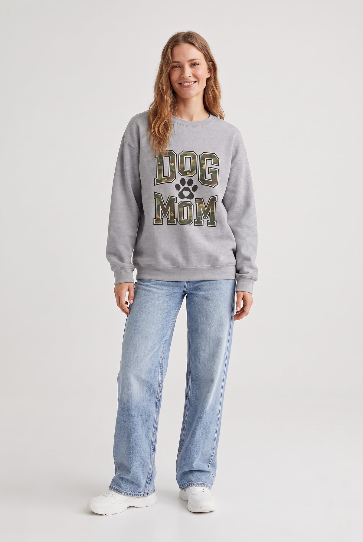 Woman wearing the Camo Dog Mom sweatshirt in sport grey, front view. Color: Sport Grey