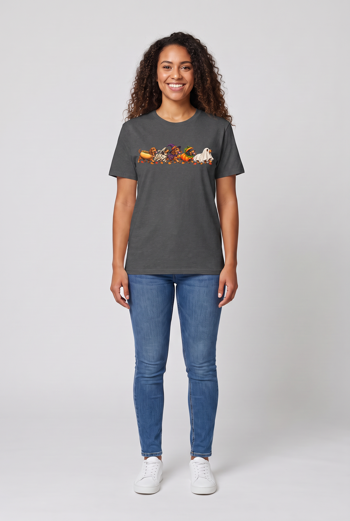 Woman wearing a dark heather wiener dog Halloween parade t-shirt with five dachshunds dressed as hot dog, mummy, witch, pumpkin and ghost, front view