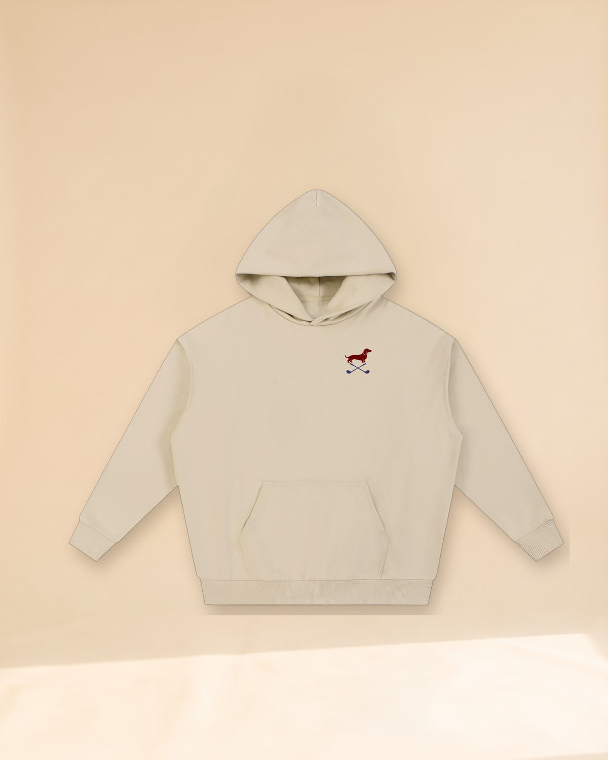 Club & Swing dachshund golf hoodie, front flatlay. Color: Apricot