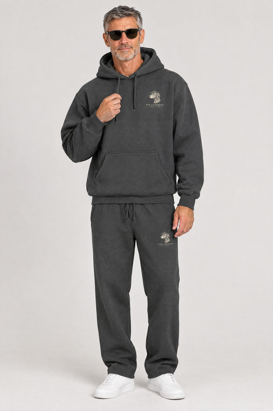 Man wearing The Sweet Spot Dalmatian golf hoodie and matching Underdog Golf Club sweatpants in Dark Gray, front view. Color: Dark Gray