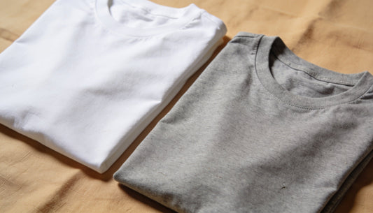 Gildan 64000 and Bella Canvas 3001 blank t-shirts folded side by side showing cotton texture