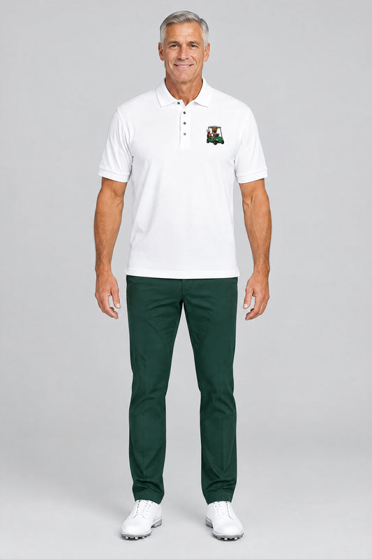 Man wearing the white French Bulldog Golf Cart embroidered polo shirt with green golf trousers