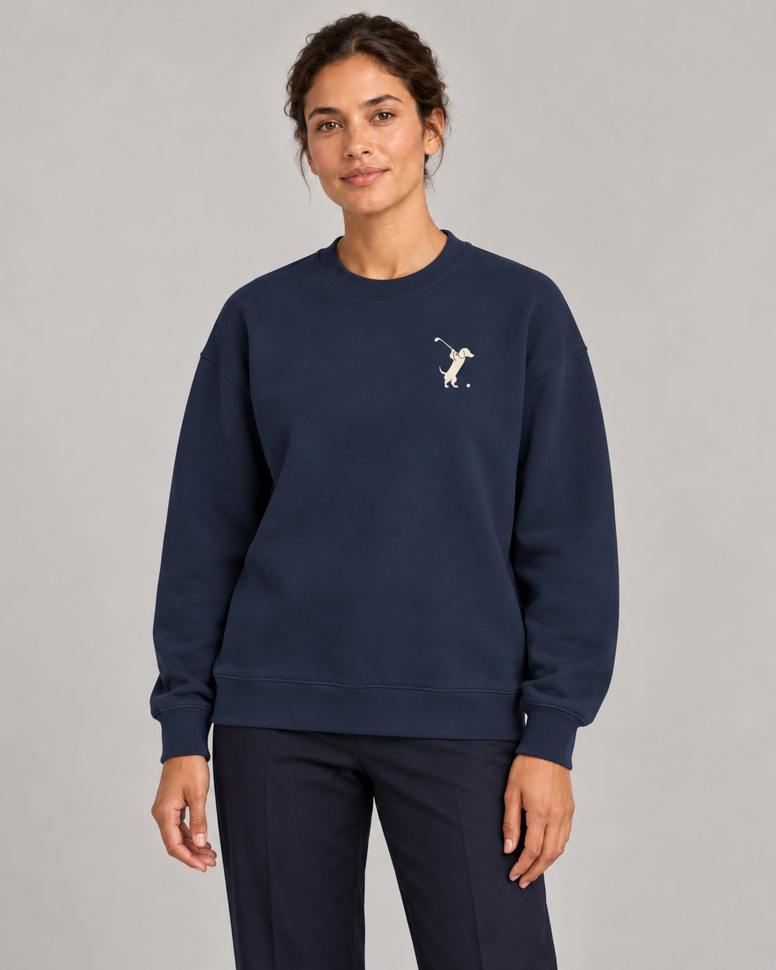 Woman wearing Swing dachshund golf sweatshirt, front studio view. Color: Navy