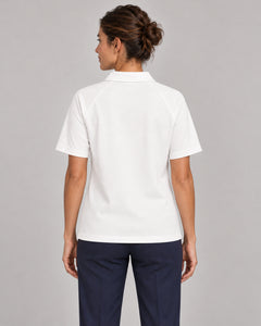 Woman wearing Putting dachshund golf polo, back studio view. Color: White