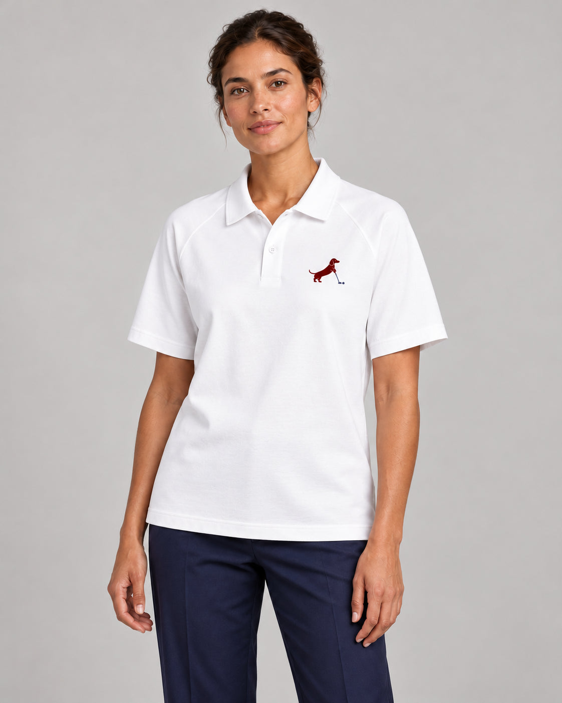 Woman wearing Putting dachshund golf polo, front studio view. Color: White