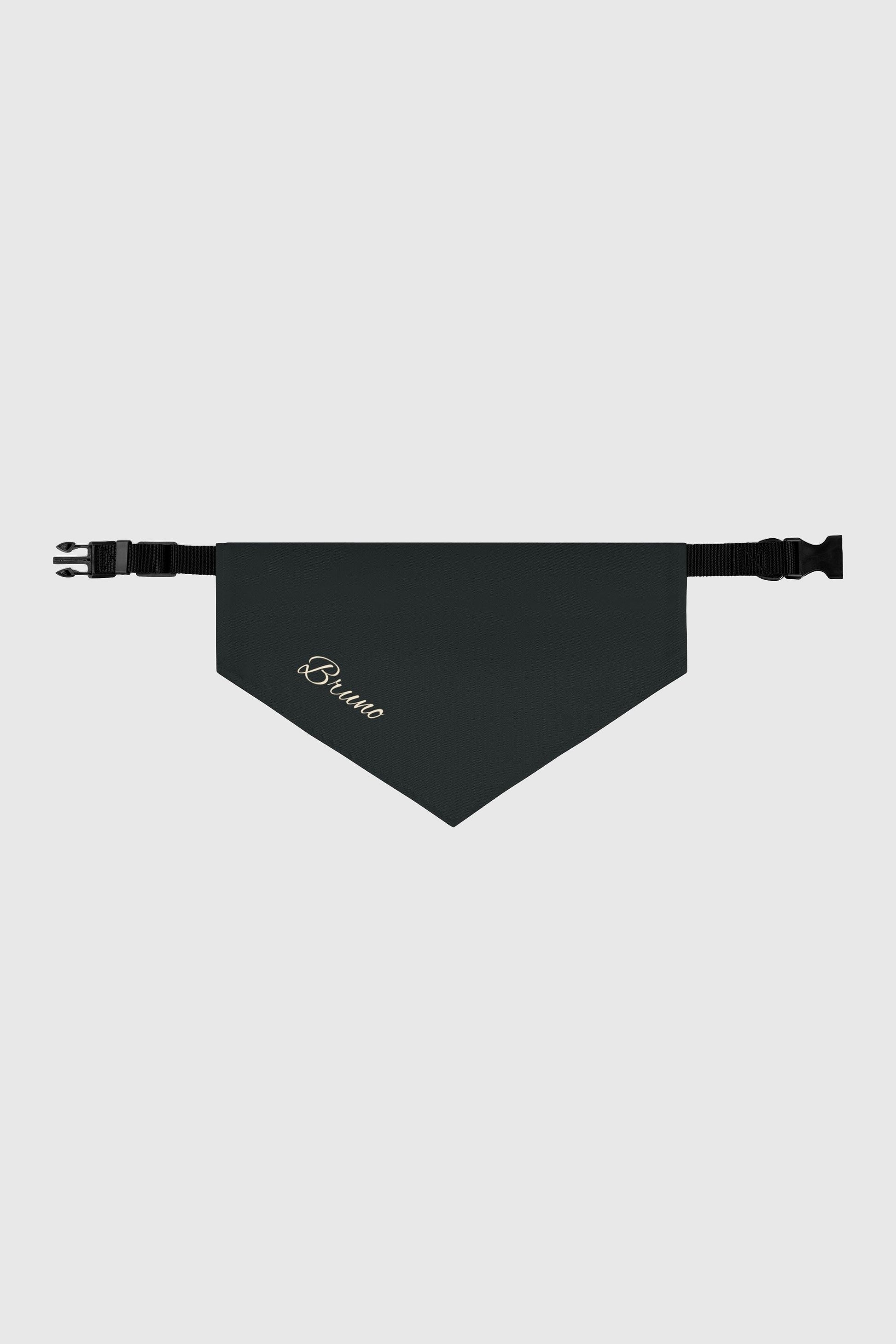 Golden retriever wearing black personalized dog bandana with custom name