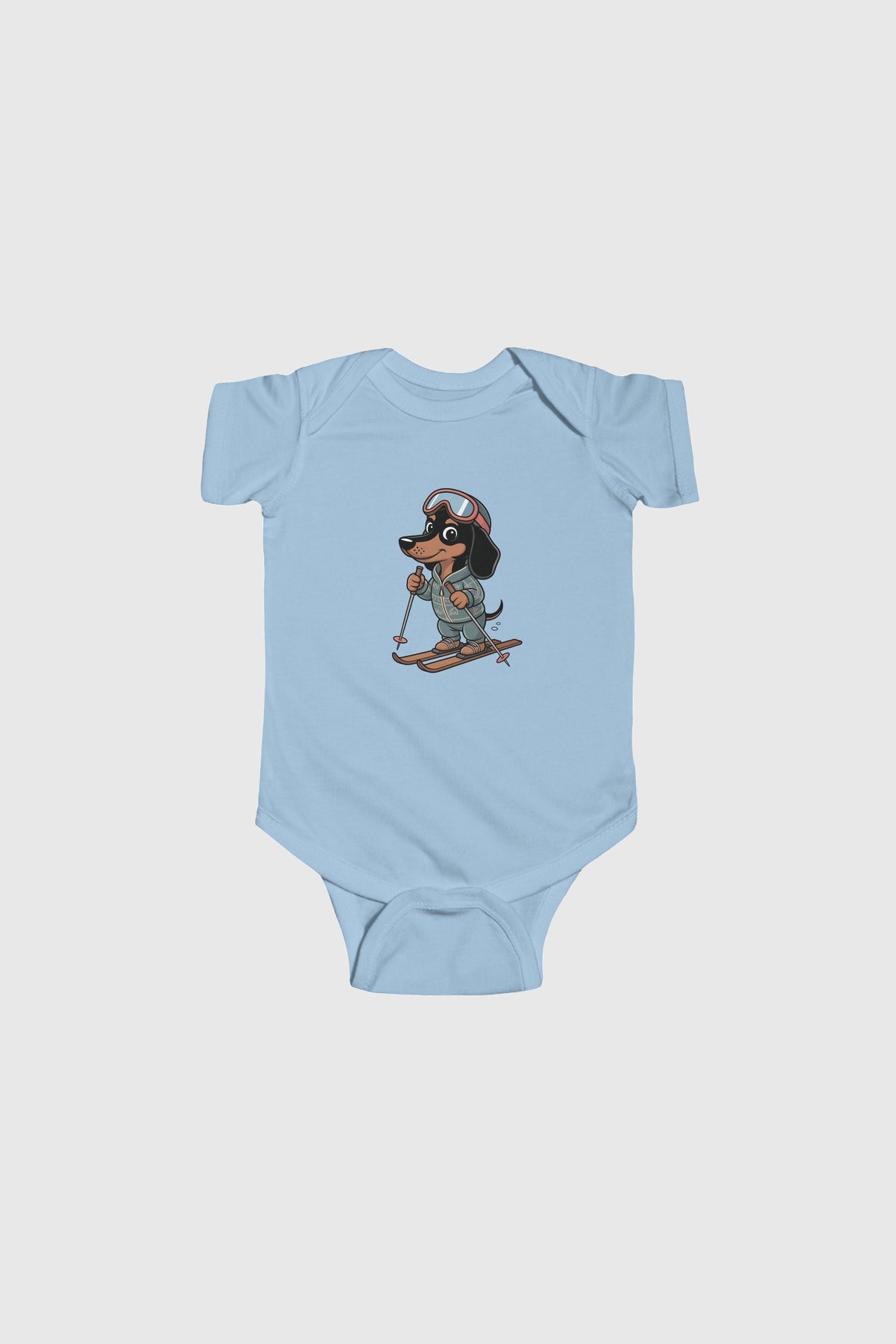 Baby wearing yellow skiing dachshund bodysuit