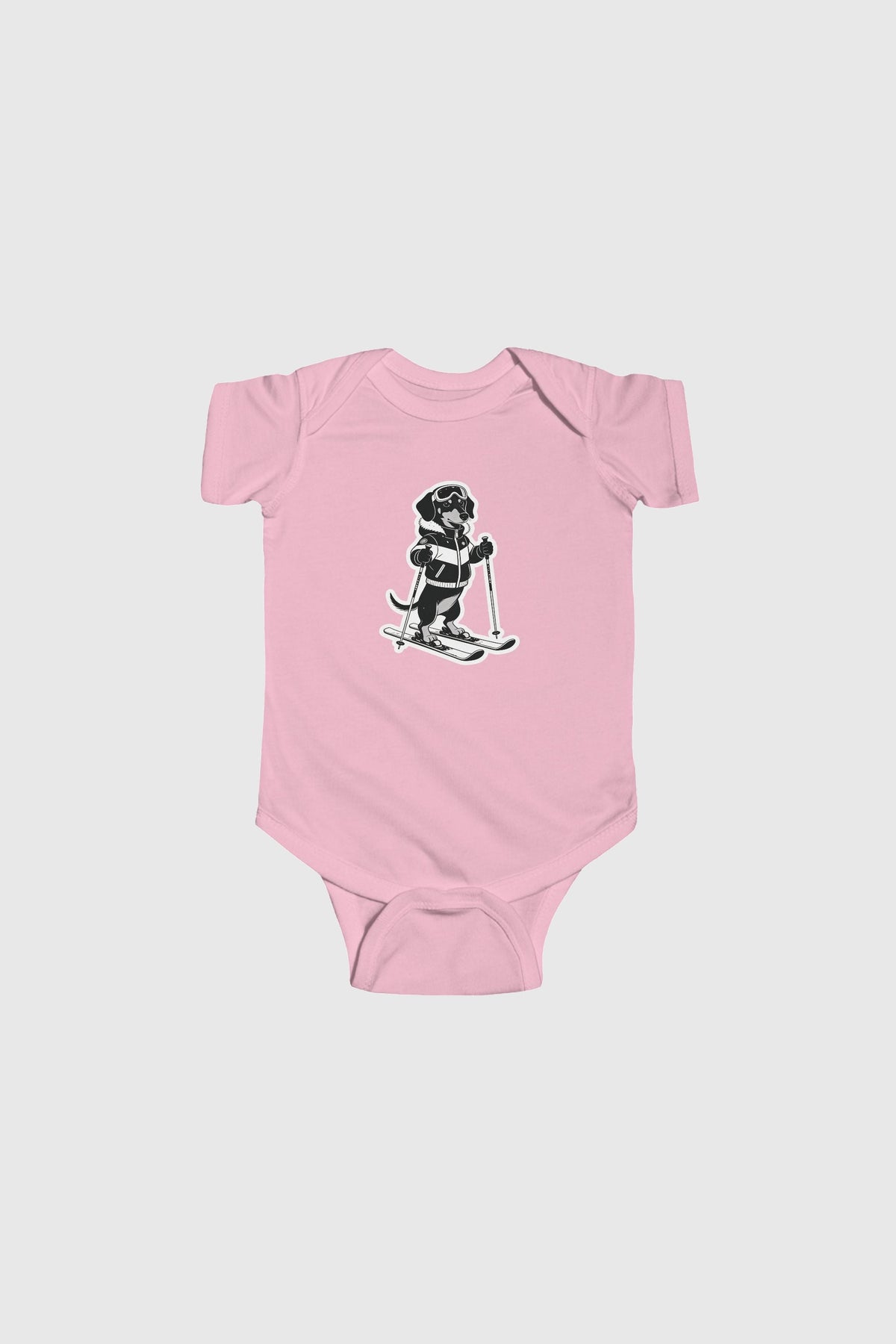 Baby wearing pink skiing black labrador bodysuit
