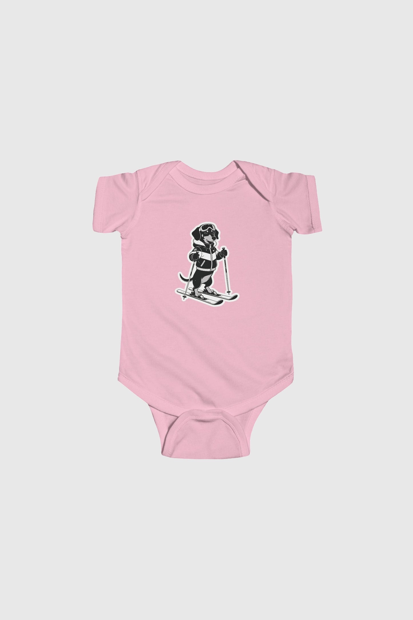 Baby wearing pink skiing black labrador bodysuit