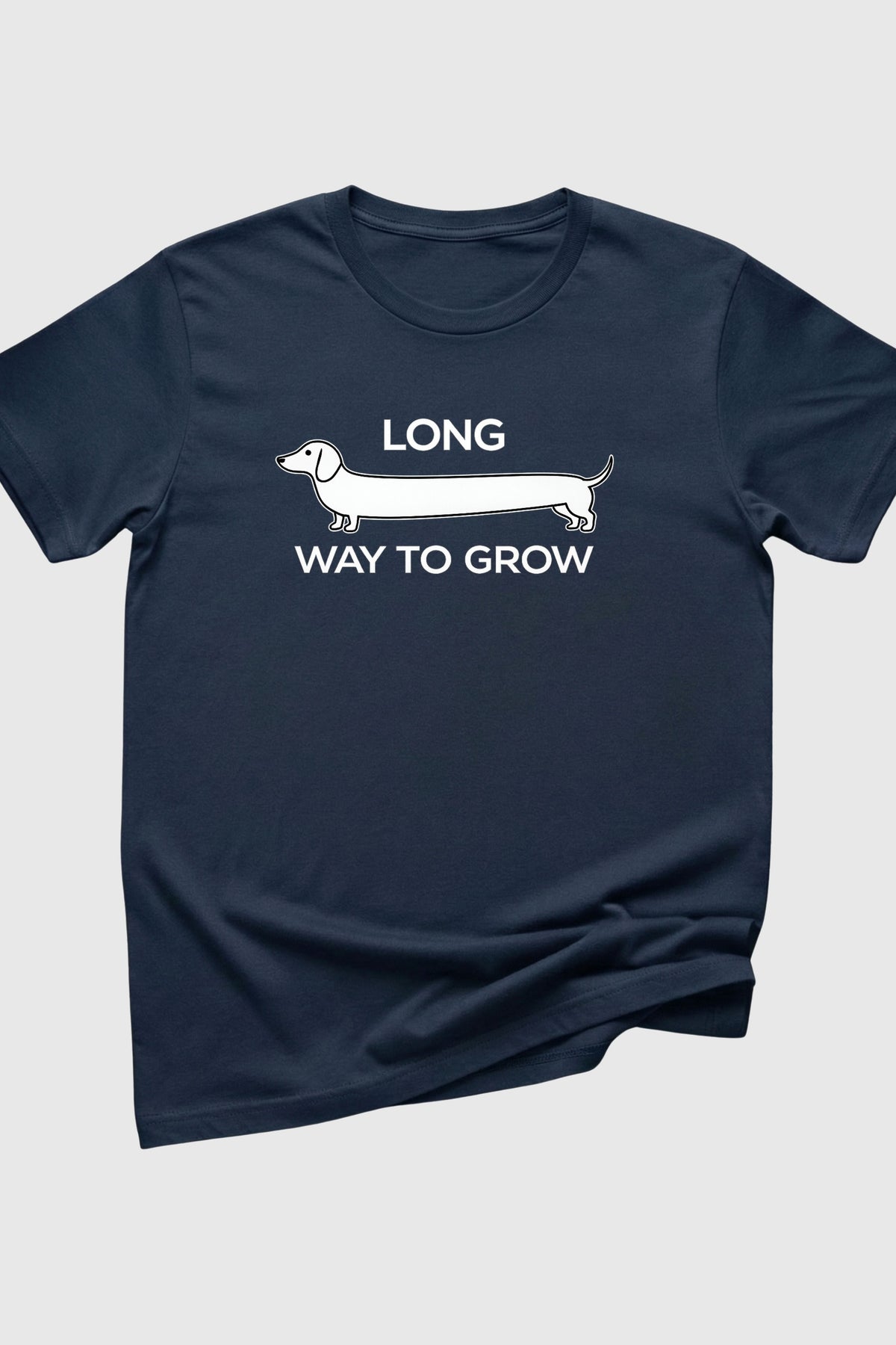 Woman wearing black Long Way to Grow dachshund t-shirt