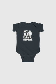 Baby wearing light blue Milk Sleep Bark Repeat bodysuit