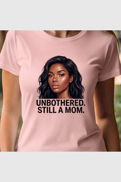 Woman wearing black Unbothered Still A Mom t-shirt