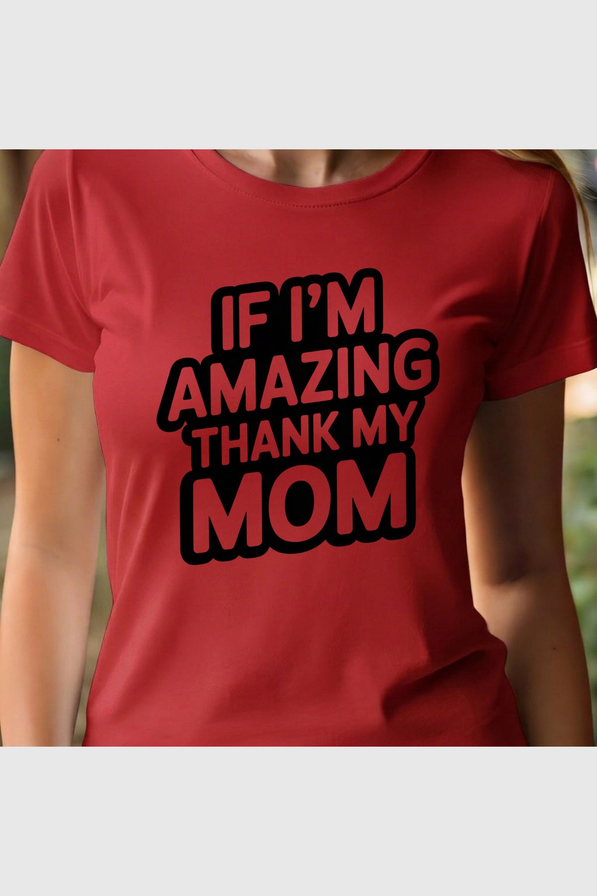 Man wearing white t-shirt with If I'm Amazing Thank My Mom print