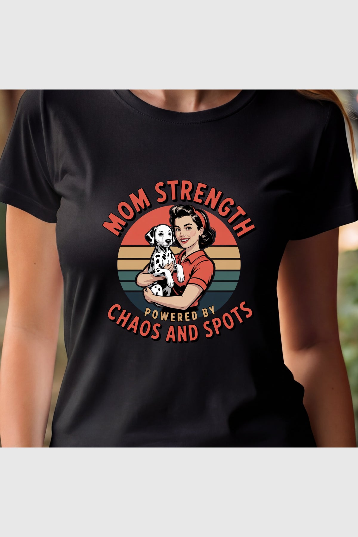 Woman wearing white Mom Strength Chaos and Spots t-shirt