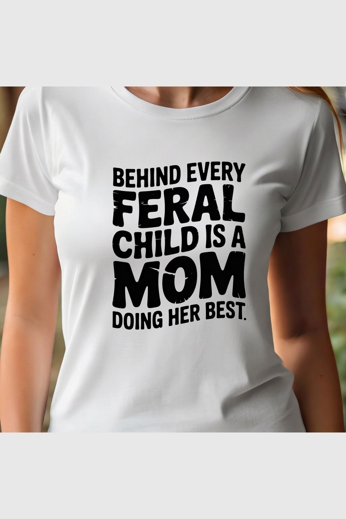 White t-shirt with Behind Every Feral Child Is a Mom Doing Her Best print, unisex crew neck