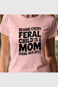 Woman wearing black Behind Every Feral Child Is a Mom t-shirt