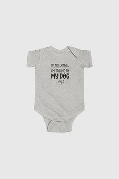 Gray baby onesie with text on a white background