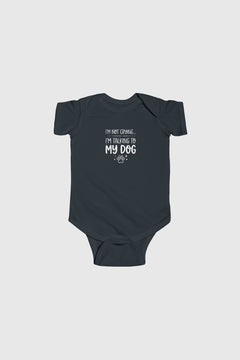 Black baby onesie with a cartoon character on a light gray background