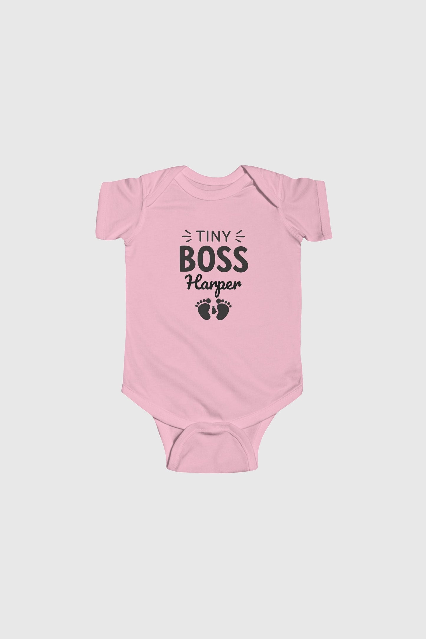 Pink personalized baby bodysuit with Tiny Boss custom name, snap closure