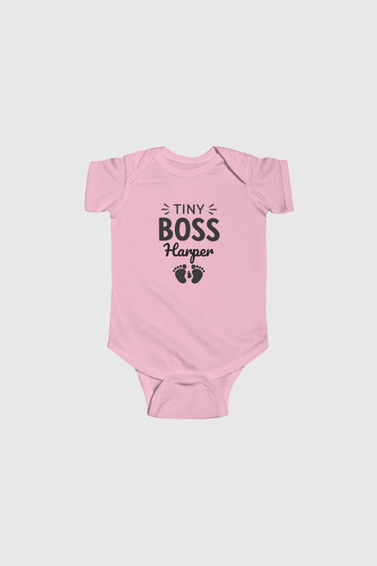 Pink personalized baby bodysuit with Tiny Boss custom name, snap closure