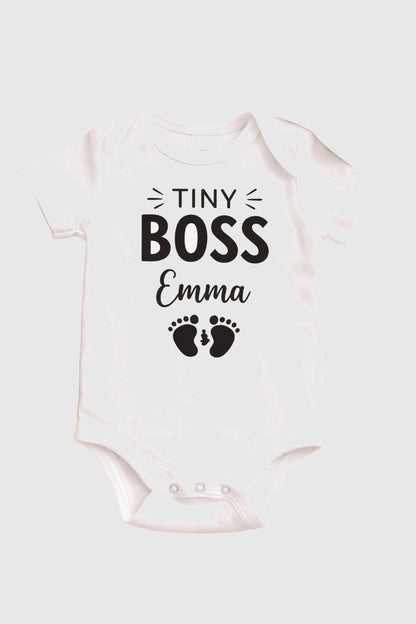 Baby wearing pink personalized Tiny Boss bodysuit