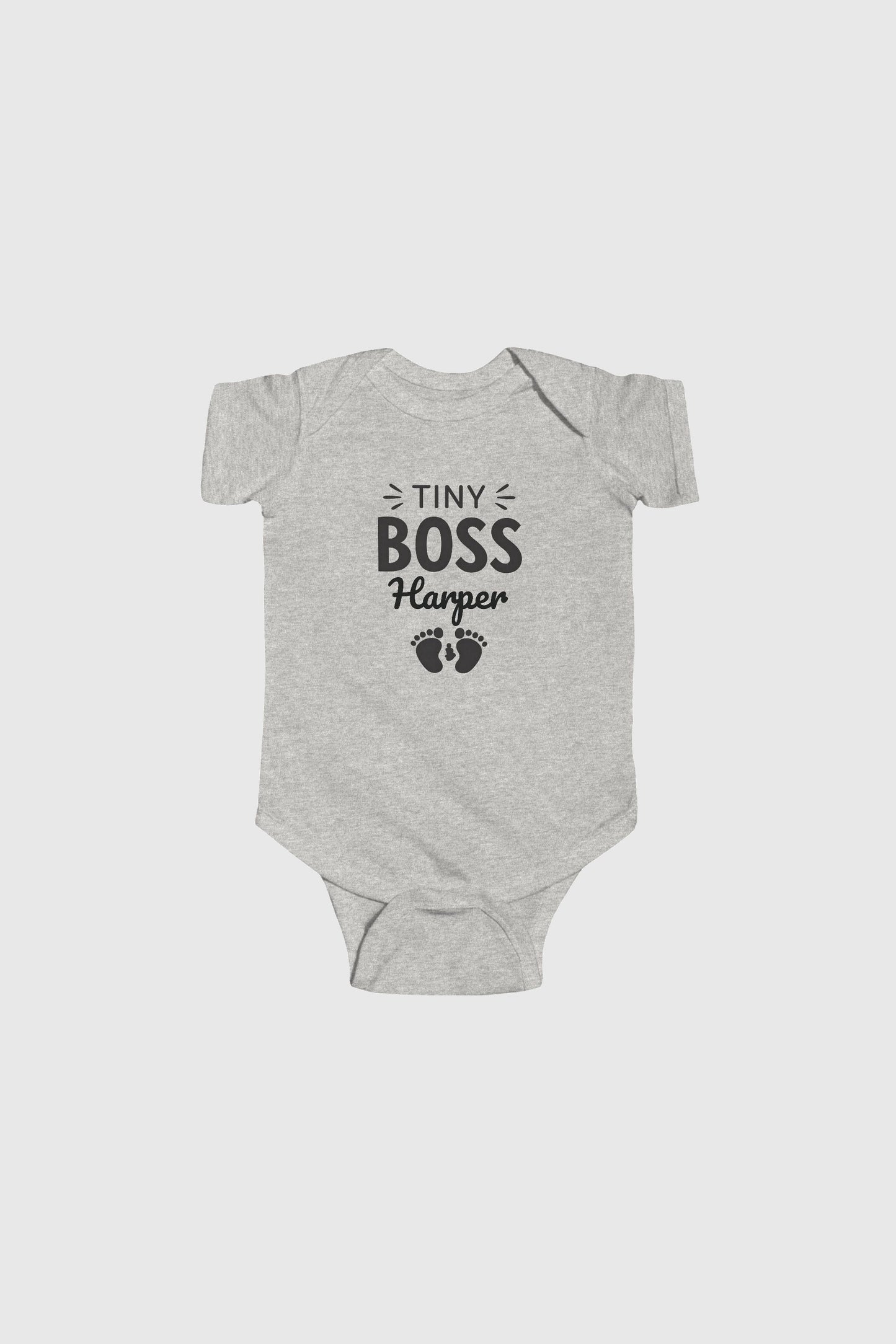 Baby wearing yellow personalized Tiny Boss bodysuit