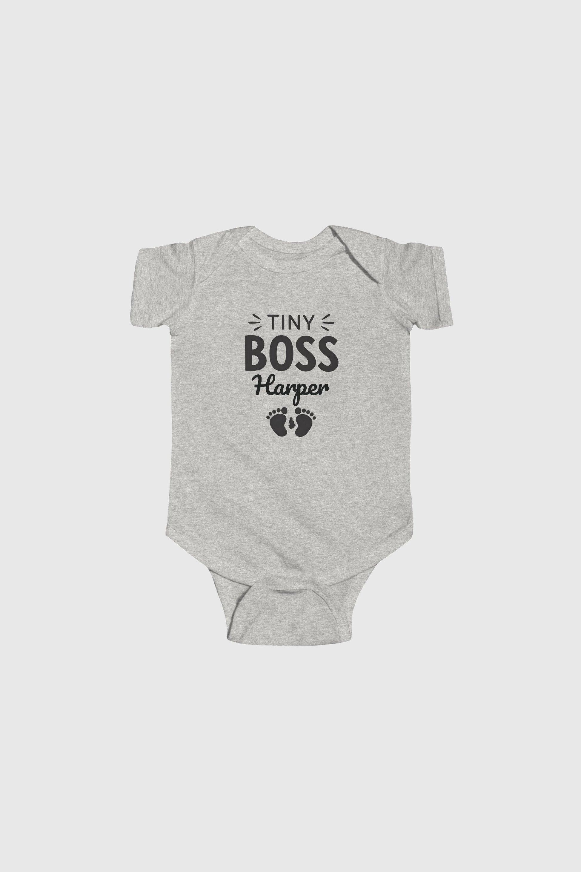 Baby wearing yellow personalized Tiny Boss bodysuit