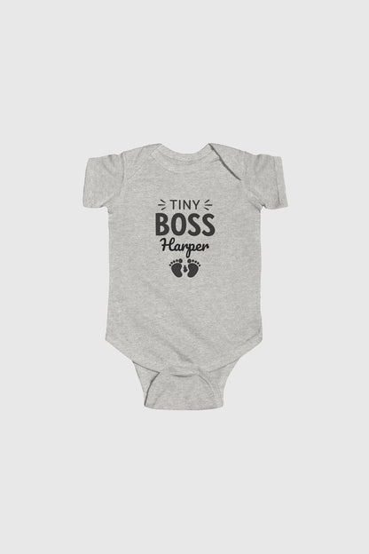 Baby wearing yellow personalized Tiny Boss bodysuit