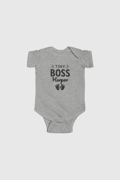 Light blue personalized baby bodysuit with Tiny Boss name, snap closure