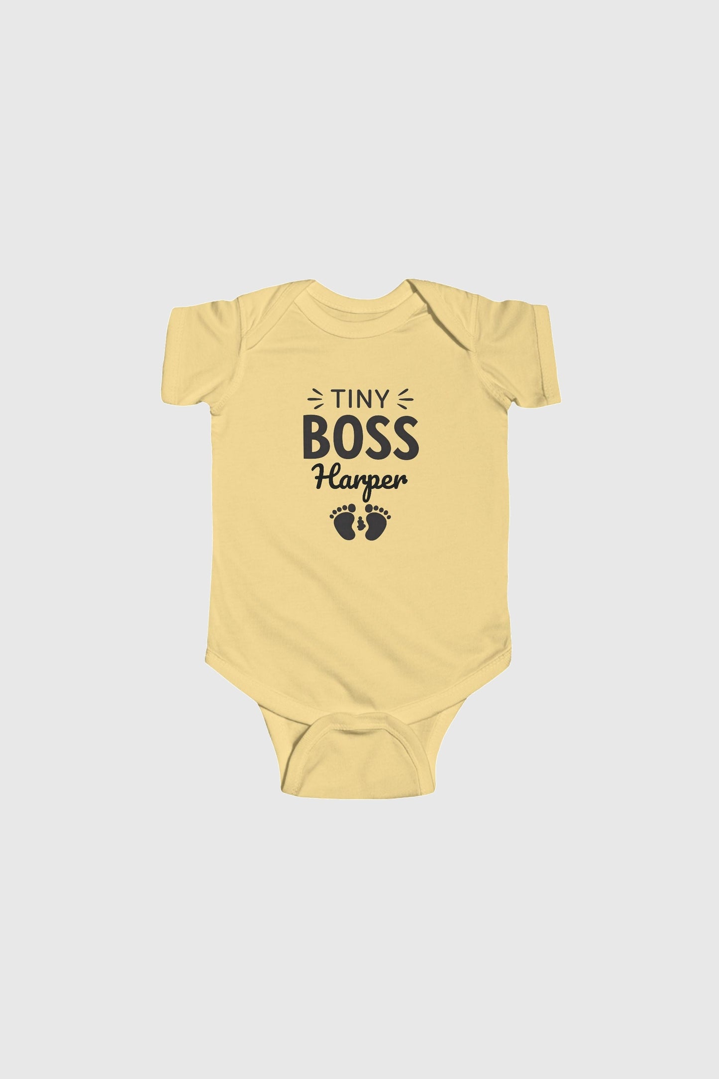 Baby wearing light blue personalized Tiny Boss bodysuit