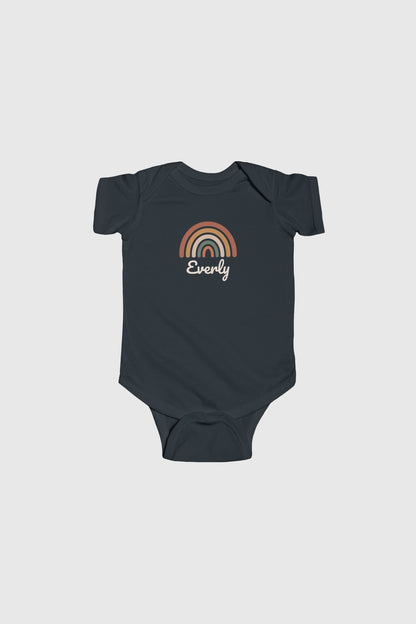 Baby wearing white personalized rainbow bodysuit, snap closure